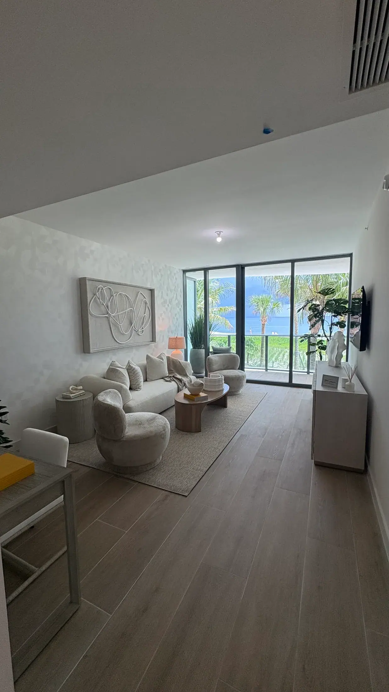 Living room facing the water with furniture pulled off the glazing