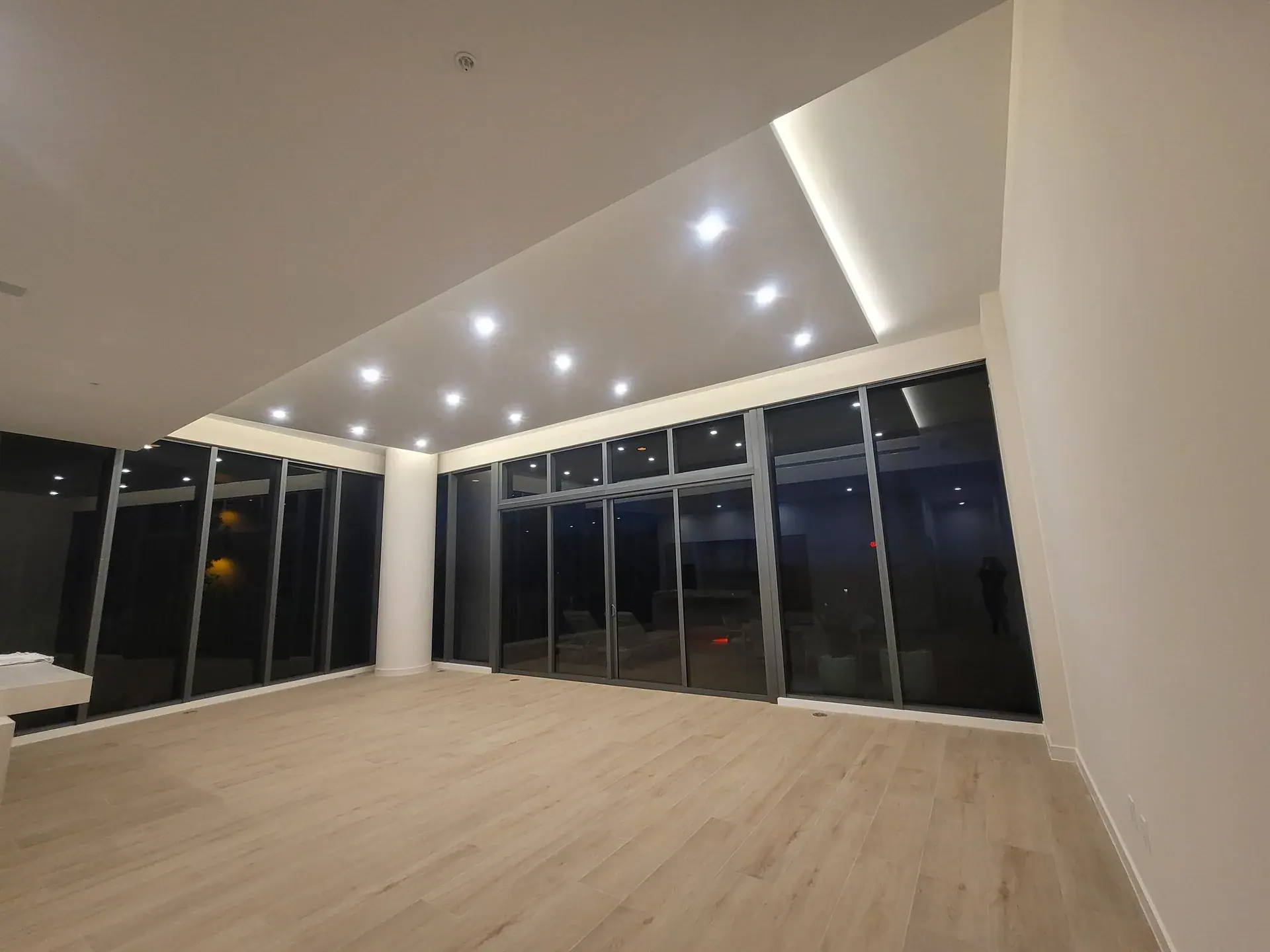 Apartment handed over before furniture, with cove lighting along the ceiling